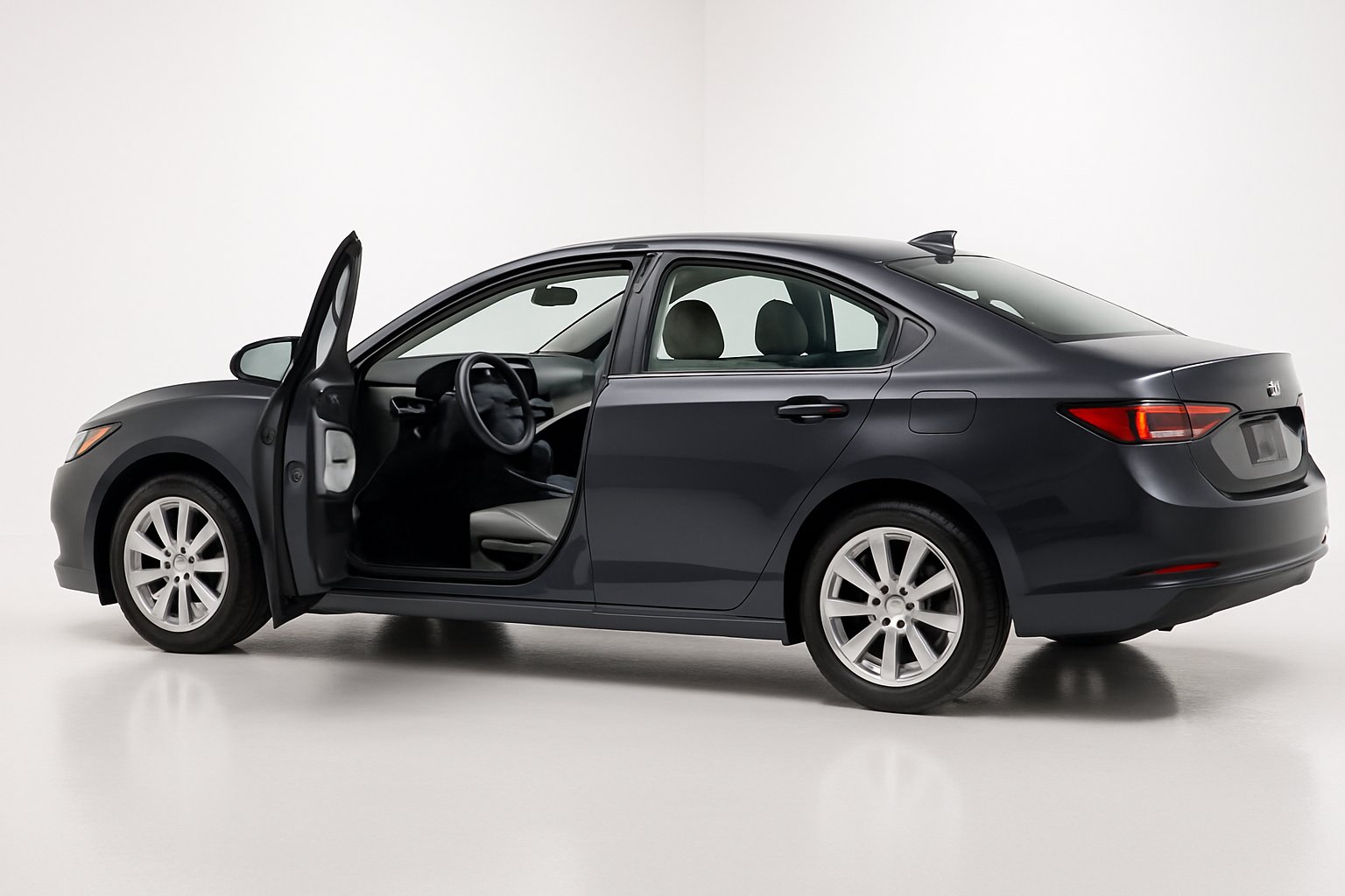 Glossy fully detailed sedan in a clean studio with a spotless interior